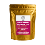 Gold tea packaging with a purple label featuring text and branding on a white background that displays "Royal Assam Premium Tea" from brand Riverbeki Tea