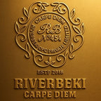 Gold embossed logo with 'Riverbeki Carpe Diem' text on a gold background