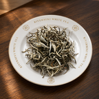 Riverbeki Silver Needle White Tea loose leaf display on branded white plate