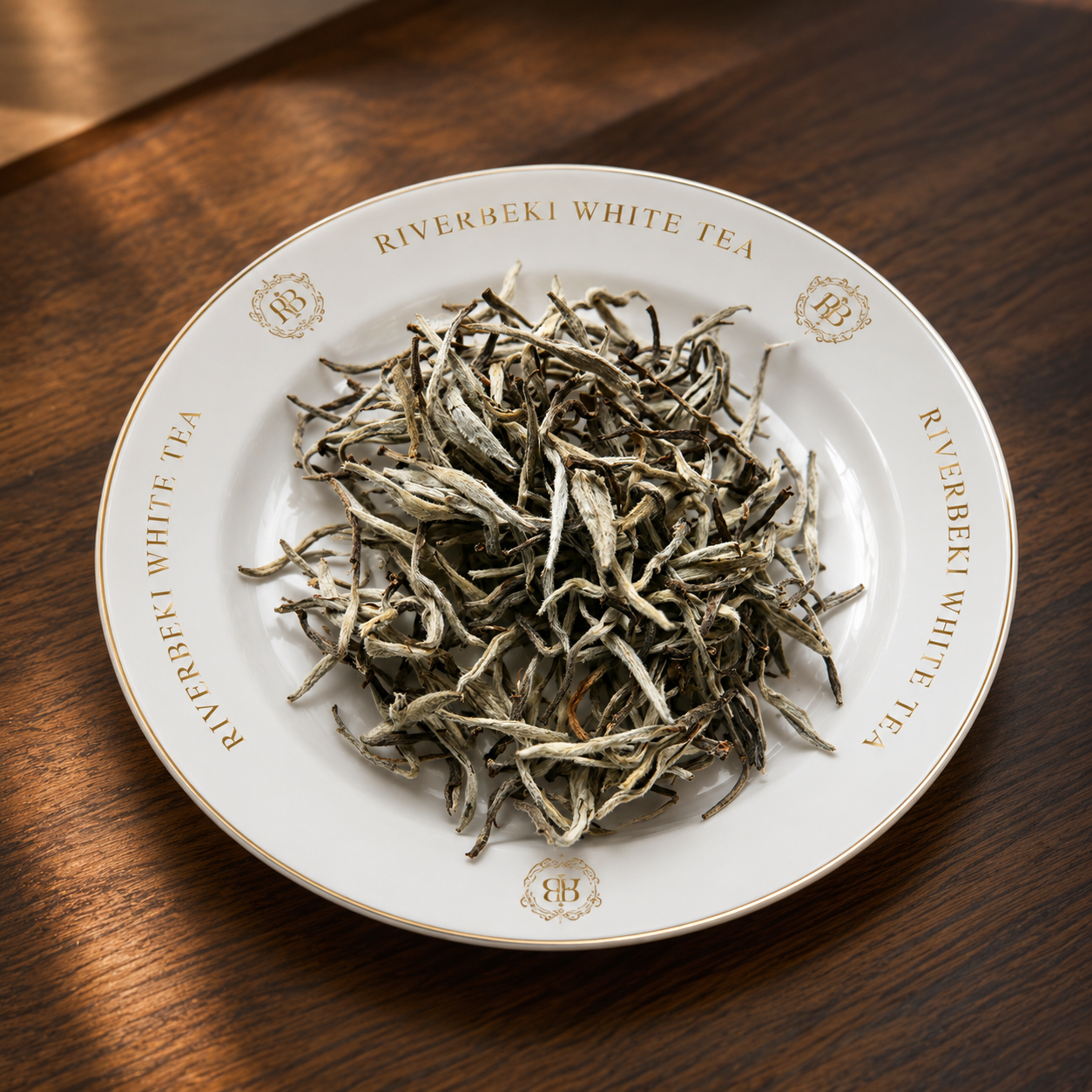 Riverbeki Silver Needle White Tea loose leaf display on branded white plate